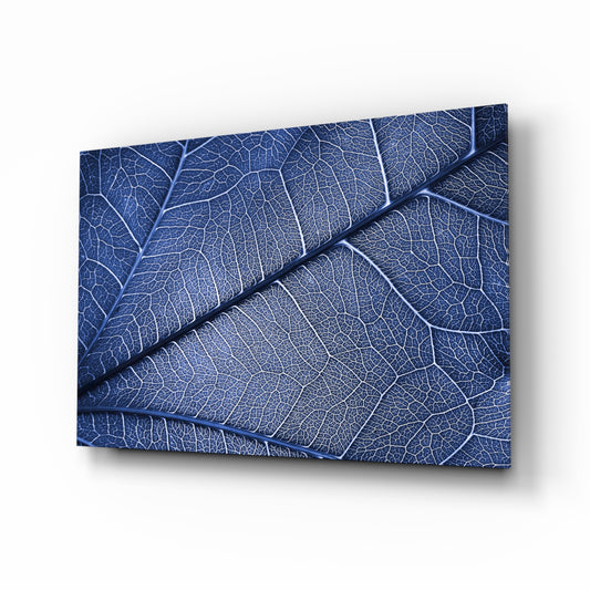 Macro Blue Leaf glass wall art displayed above a console in a designer interior