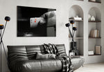 Playing Cards glass wall art styled above a console in a poker man-cave