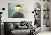 Cloud Man glass wall art styled above a desk in an introspective study