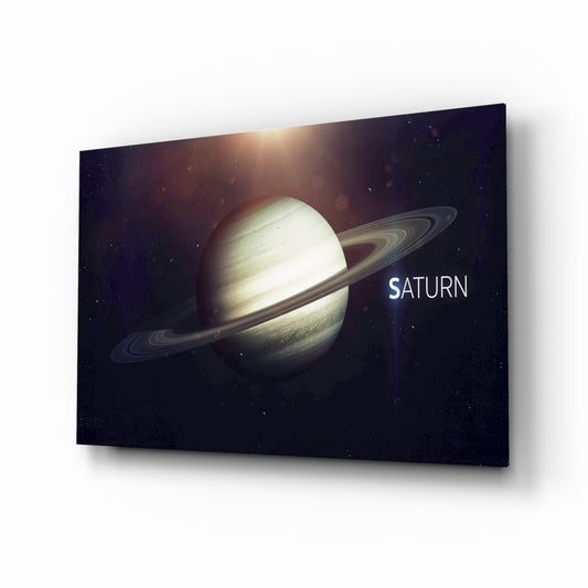Saturn glass wall art displayed above a console in a designer interior