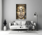 Close-up detail of bronze Buddha face with gilded bamboo-leaf strands