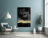 Words glass wall art styled above a desk in an executive-mood study