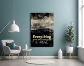 Words glass wall art styled above a desk in an executive-mood study