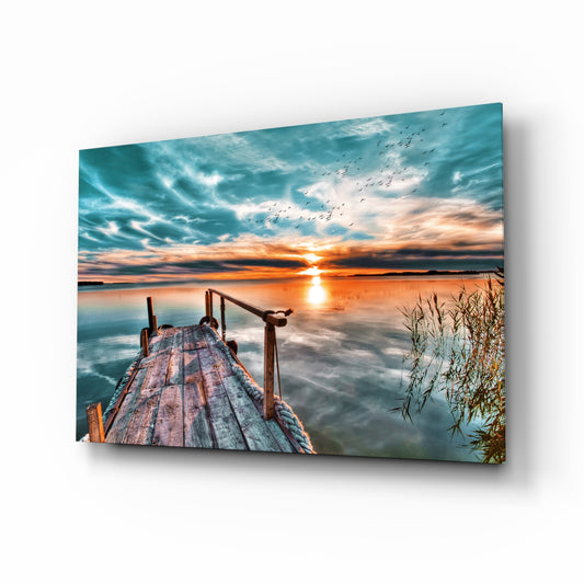 Sunset glass wall art displayed above a console in a designer interior