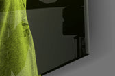 Green Lion Head artwork anchoring a wall with moody conceptual palette