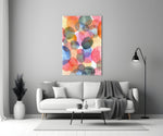 Close-up detail of overlapping pink, teal, and ochre watercolor circles