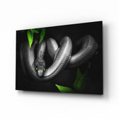 Snake glass wall art displayed above a console in a designer interior