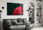 Red Umbrella glass wall art styled above a console in a foyer