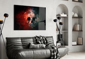 Skull glass wall art styled above a desk in an introspective study