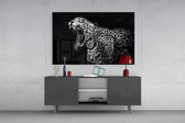 Leopard panel catching low light to reveal its chiaroscuro intensity