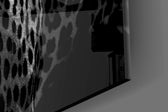 Leopard artwork anchoring a library with moody palette
