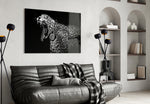 Leopard glass wall art styled above a desk in an executive-presence study