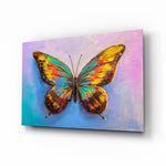 Butterfly glass wall art displayed above a console in a designer interior