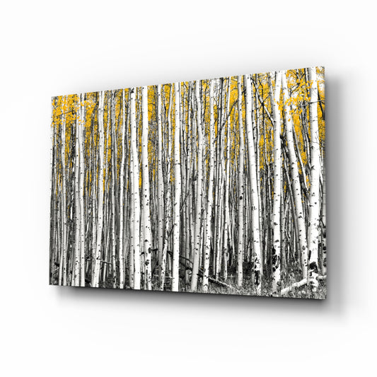 Yellow Forest glass wall art displayed above a console in a designer interior