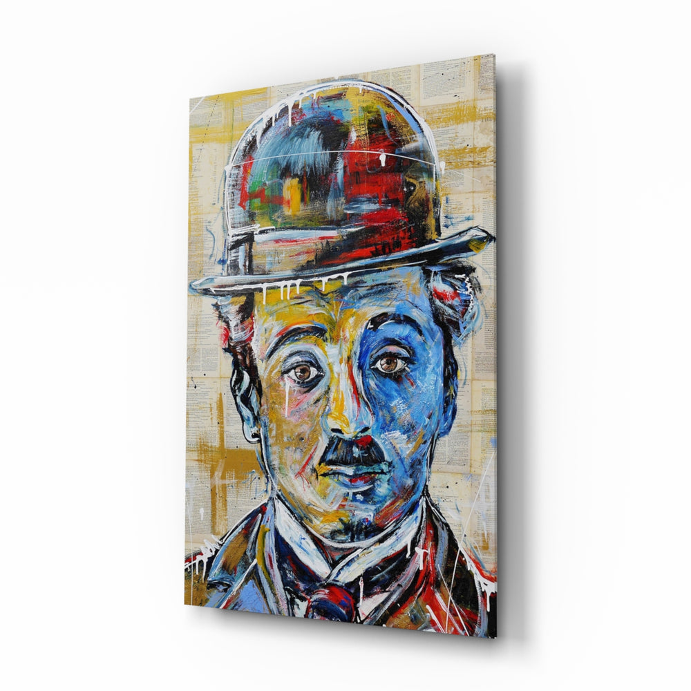 Charlie Chaplin glass wall art displayed above a console in a designer interior
