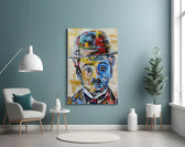 Charlie Chaplin glass wall art styled above a media console in a home theater