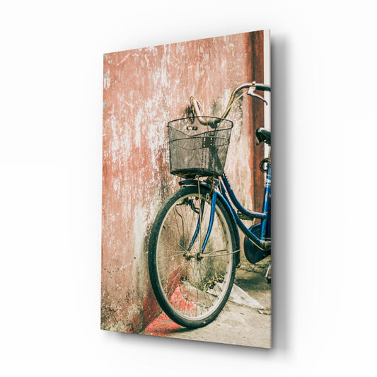 Bicycle Basket glass wall art displayed above a console in a designer interior