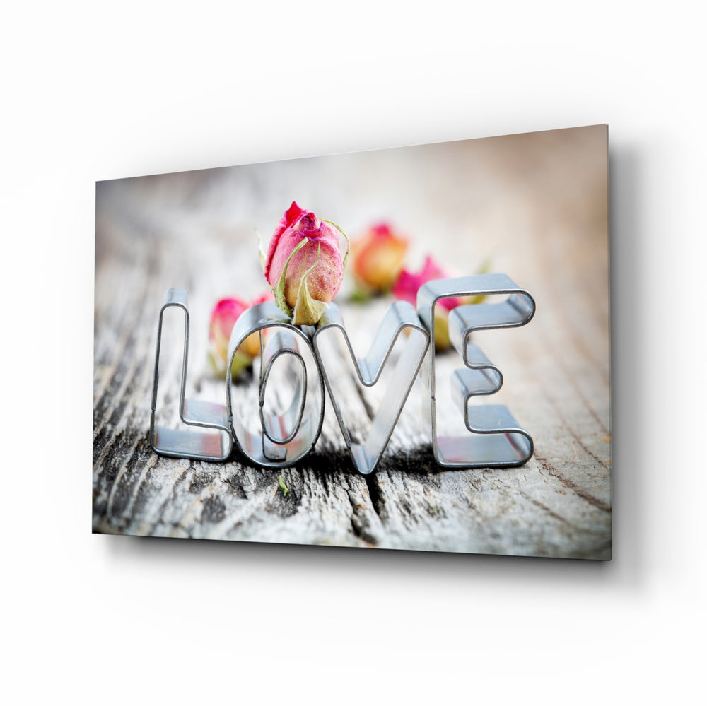 Love glass wall art displayed above a console in a designer interior