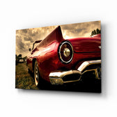 Red Chevrolet glass wall art displayed above a console in a designer interior