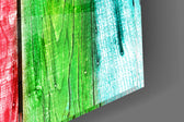 Colored Wood artwork anchoring a wall with bold eclectic palette