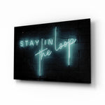 Stay in the Loop glass wall art displayed above a console in a designer interior