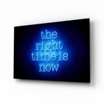The Right Time Is Now glass wall art displayed above a console in a designer interior