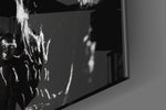 Skull artwork anchoring a wall with moody gothic palette