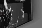Skull artwork anchoring a wall with moody gothic palette