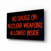 No Drugs glass wall art displayed above a console in a designer interior