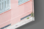 Pink House artwork anchoring a wall with soft wanderlust palette