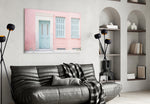 Pink House glass wall art styled above a bench in a hallway