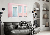Pink House glass wall art styled above a bench in a hallway