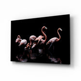 Flamingos glass wall art displayed above a console in a designer interior