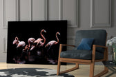 Flamingos glass print enhancing a lounge with after-hours drama