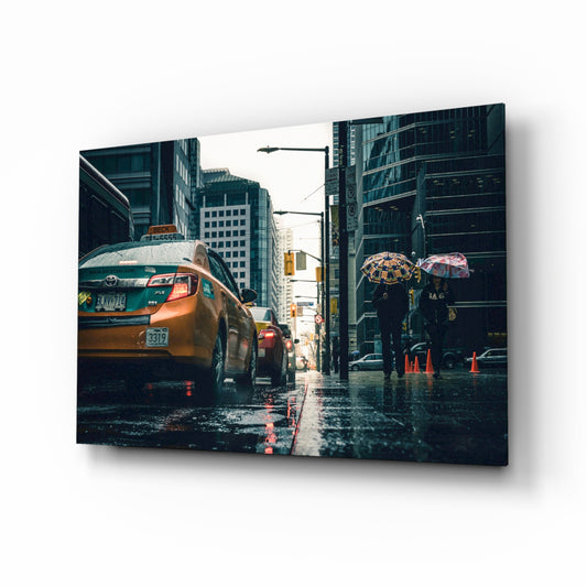 Rain in the City glass wall art displayed above a console in a designer interior