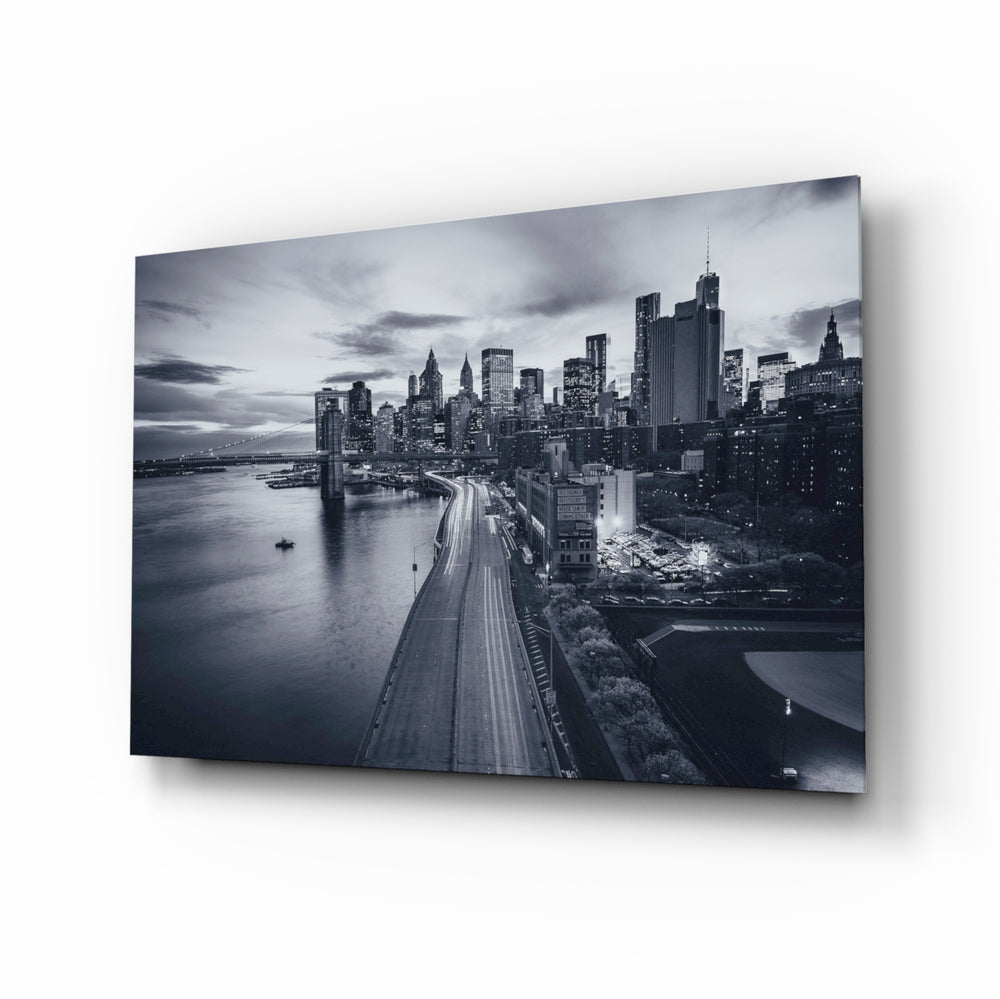 Gray City Landscape glass wall art displayed above a console in a designer interior