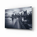 Gray City Landscape glass wall art displayed above a console in a designer interior