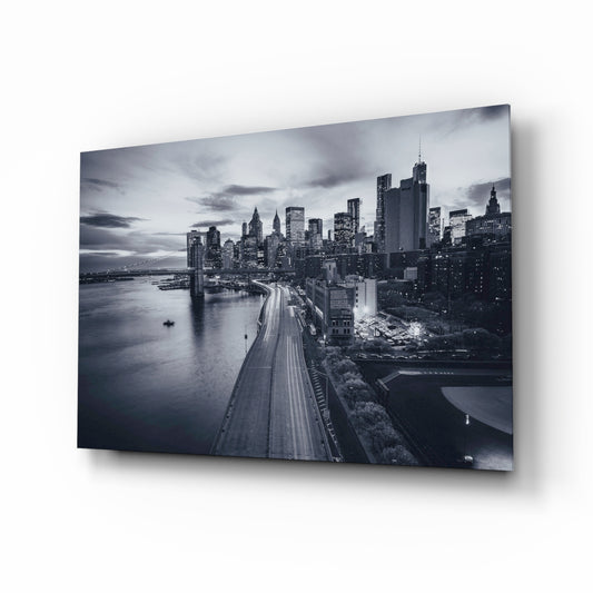 Gray City Landscape glass wall art displayed above a console in a designer interior