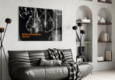 Never Give Up glass wall art styled above a desk in a discipline study