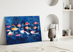 Close-up detail of coral fish silhouettes against indigo wash