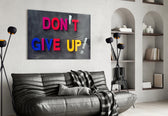 Don't Give Up glass wall art styled above a desk in a child's room