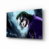 Joker glass wall art displayed above a console in a designer interior