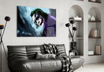 Joker glass wall art styled above a desk in a teen room