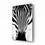 Zebra glass wall art displayed above a console in a designer interior