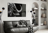 Bison glass wall art styled above a desk in an introspective study