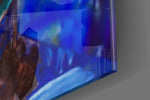 Women's artwork anchoring a wall with bold art-room palette