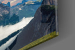 Mountains artwork anchoring a wall with bold panoramic palette