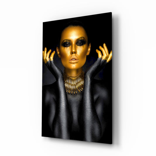 Gold Woman glass wall art displayed above a console in a designer interior