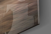 Coastal artwork anchoring a wall with warm coastal palette