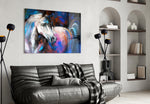 White Horse glass wall art styled above a desk in an introspective study
